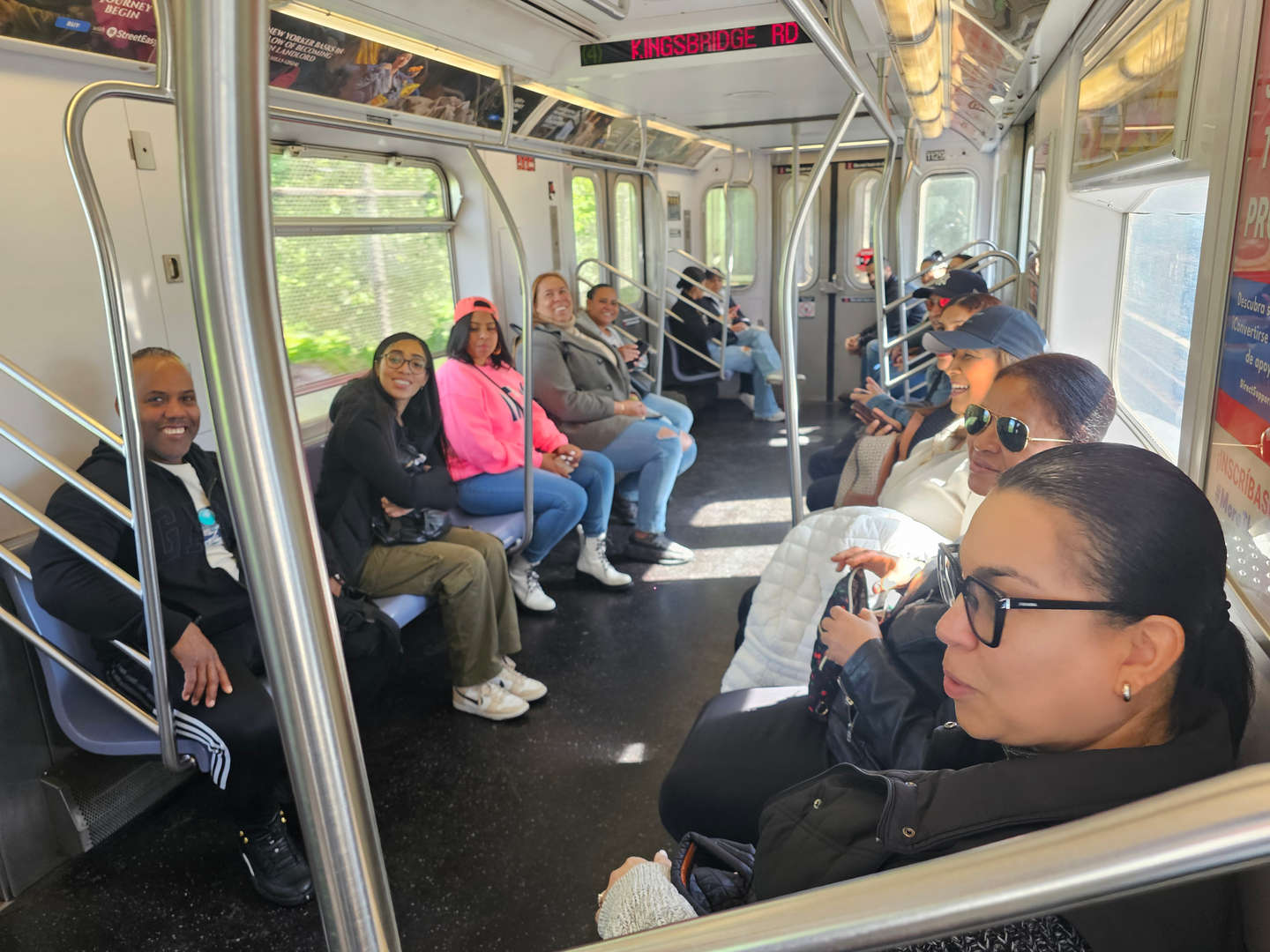 Parents and staff riding the New York City subway together