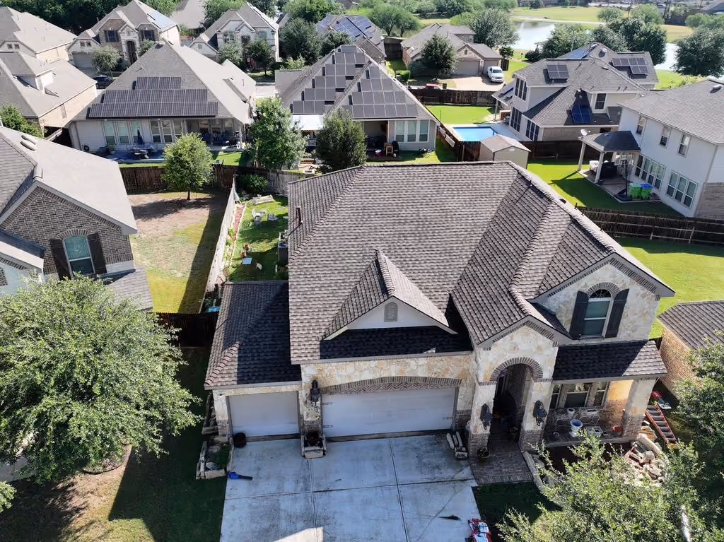 Completed residential shingle roof replacement viewed from above
