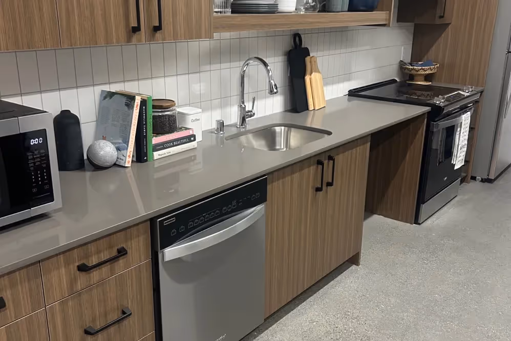 Kitchen with brown cabinets and stainless steel appliances