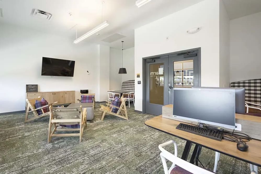 Room with computers and table and chairs