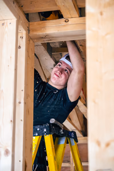 Young caucasian male working on a construction site.
