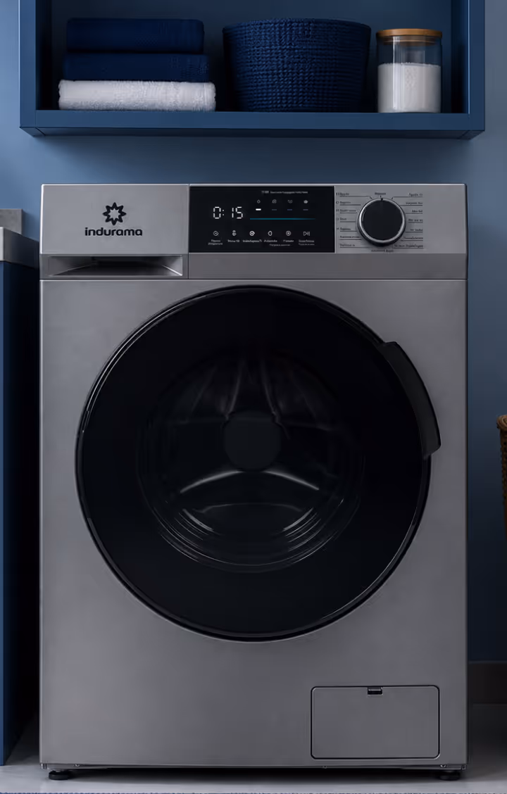 Modern black front-loading washing machine with digital display and control knob in a light room.