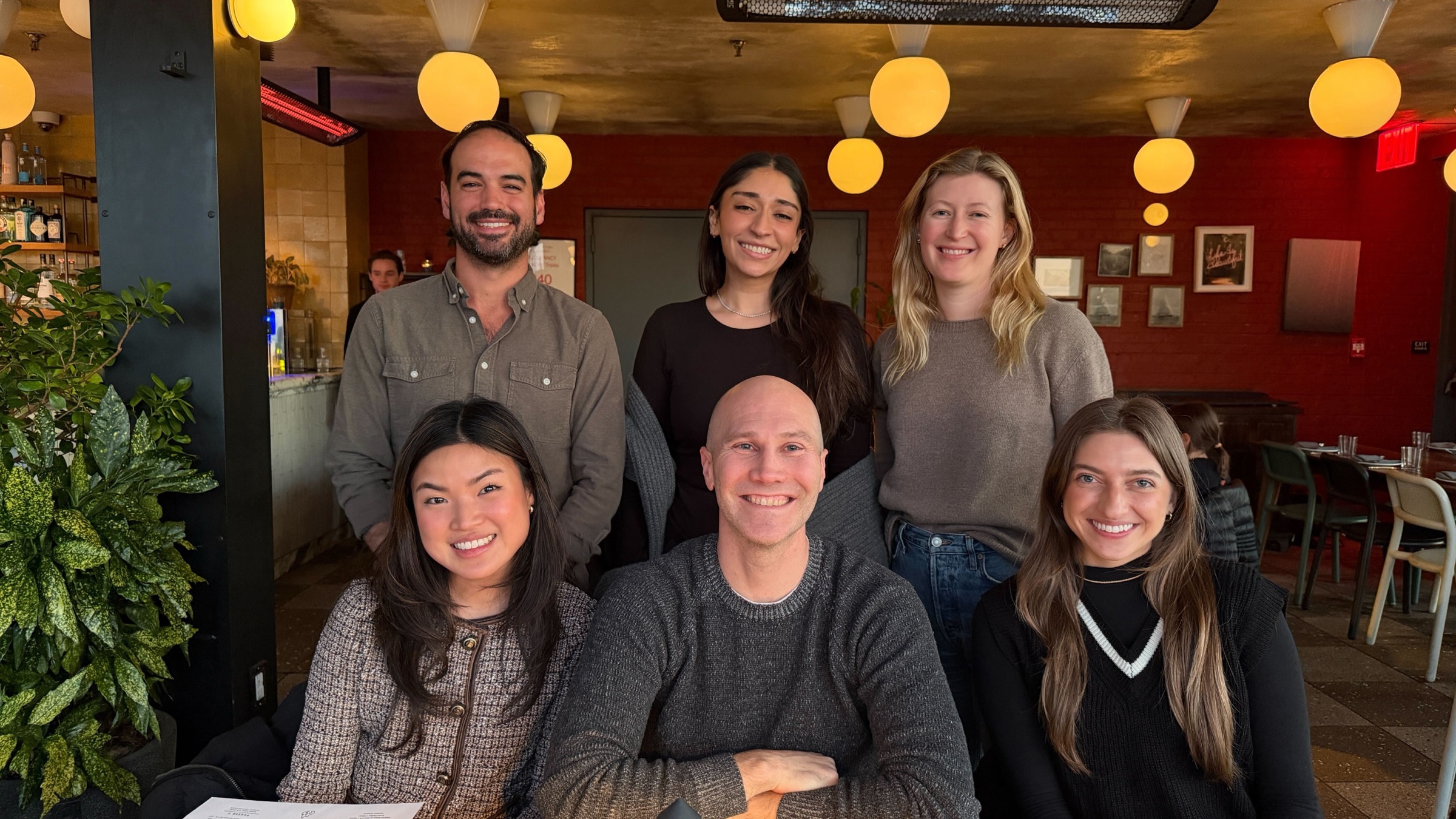 The Goodword team together at a restaurant dinner