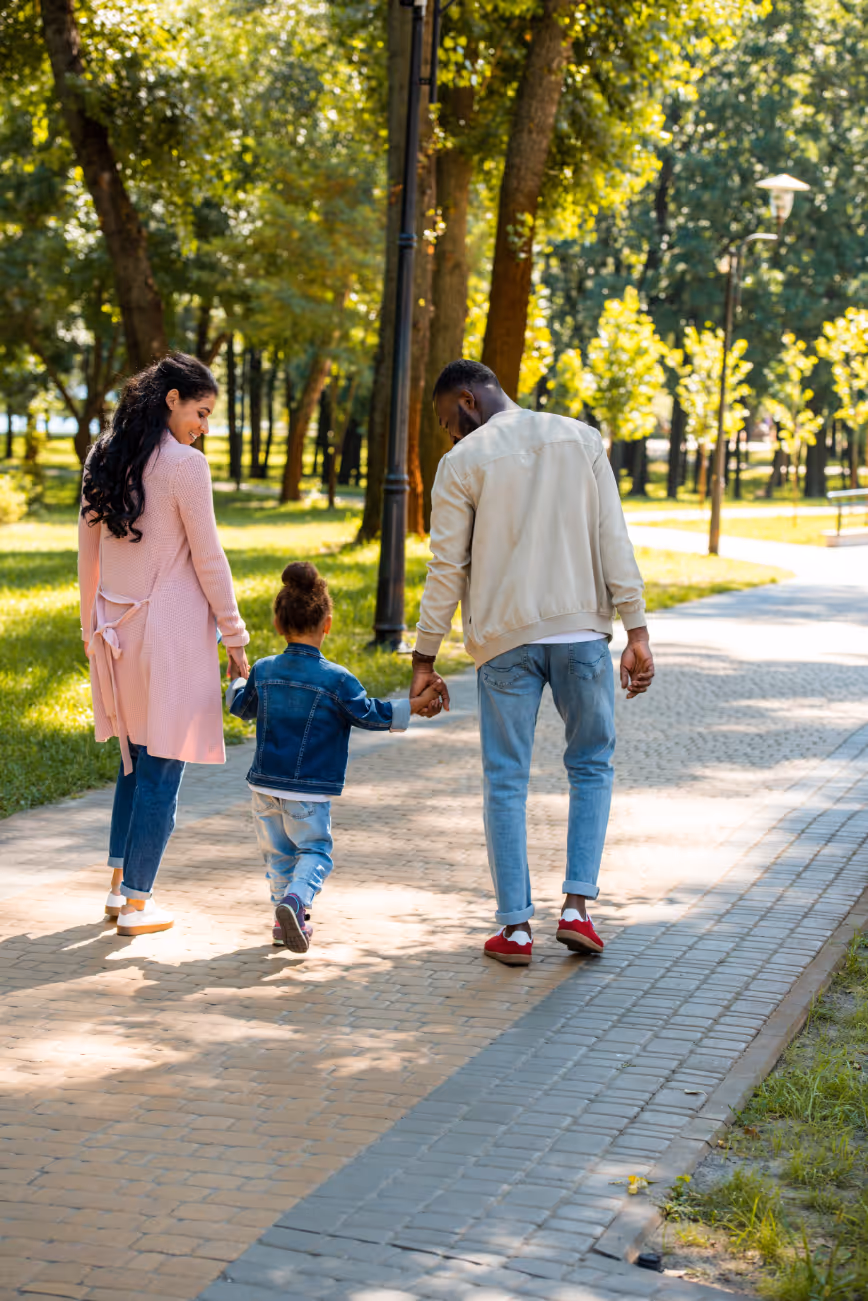 Family walking in park stock image