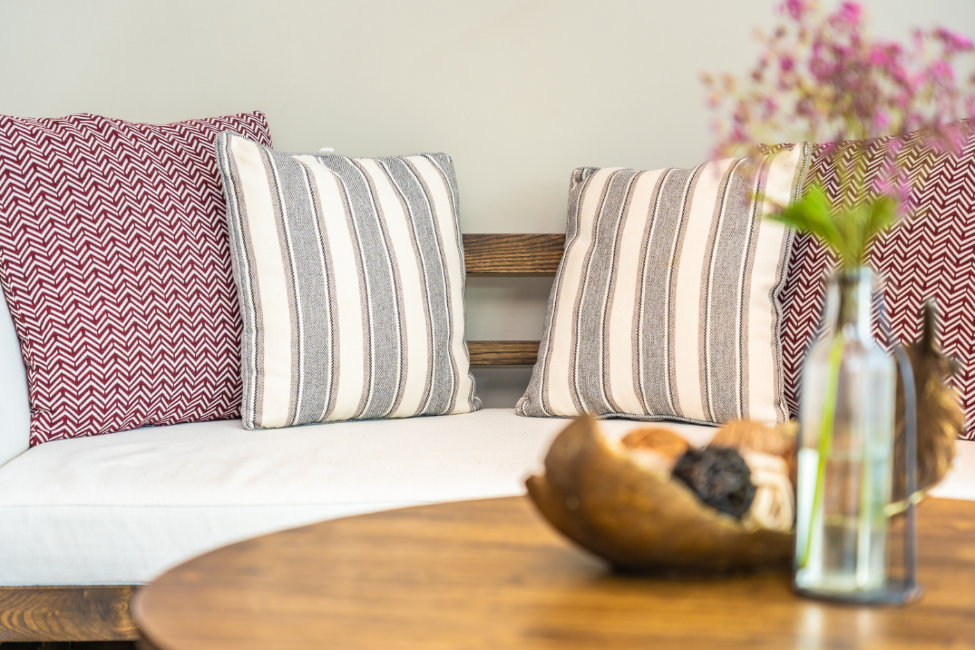 Pillows near table with plants stock image
