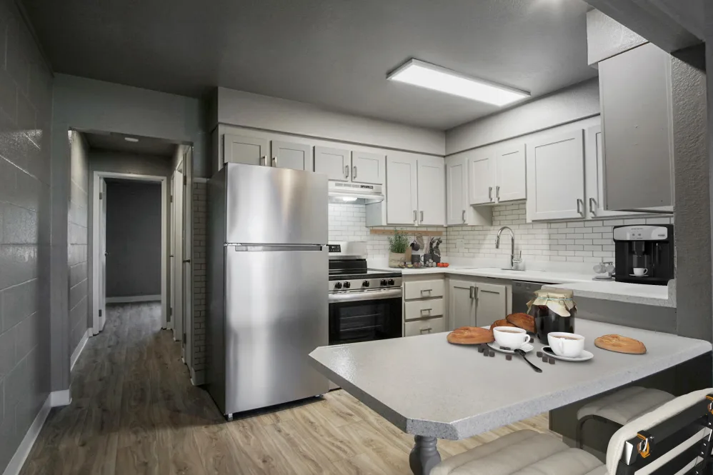 Kitchen with stainless steel appliances and virtually staged decor