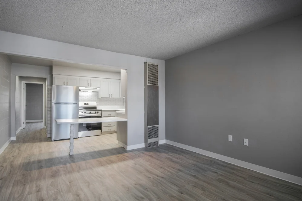 Unfurnished living area with view of kitchen