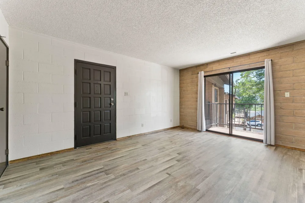 Unfurnished dining area with view of balcony