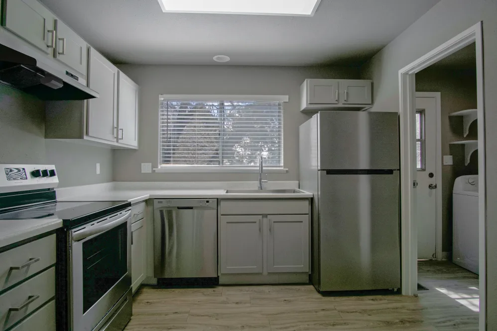 Kitchen with stainless steel appliances and white cabinets