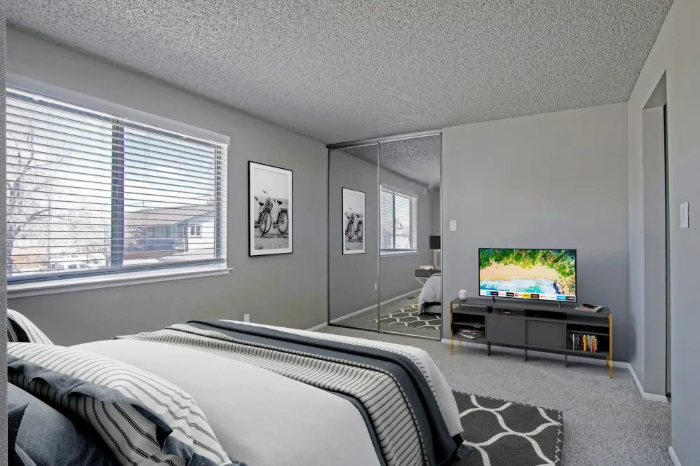 Virtually furnished bedroom with bed, tv, rug, and large window