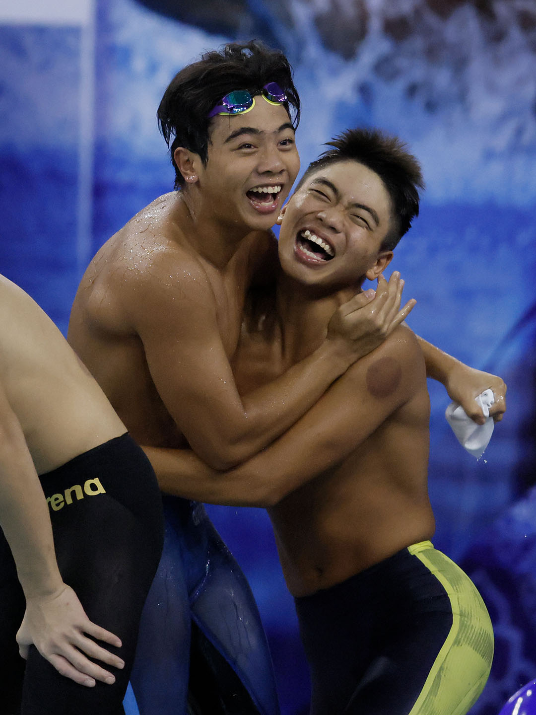 Malaysia's Boys 4x100 Free Relay team celebrating bronze