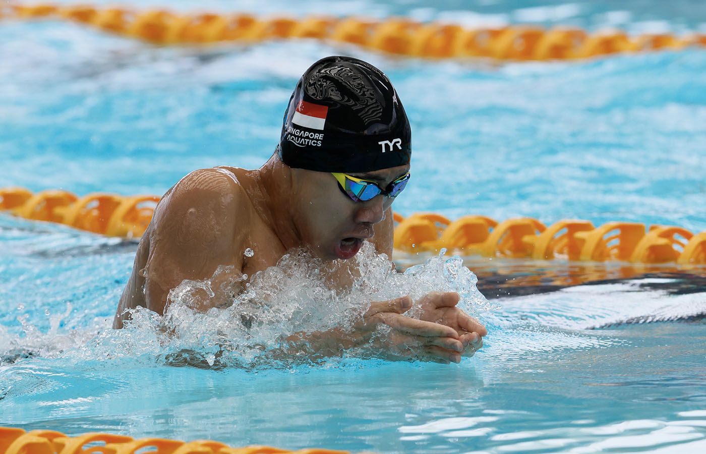 Marcus Chong mid-stroke during a breaststroke race