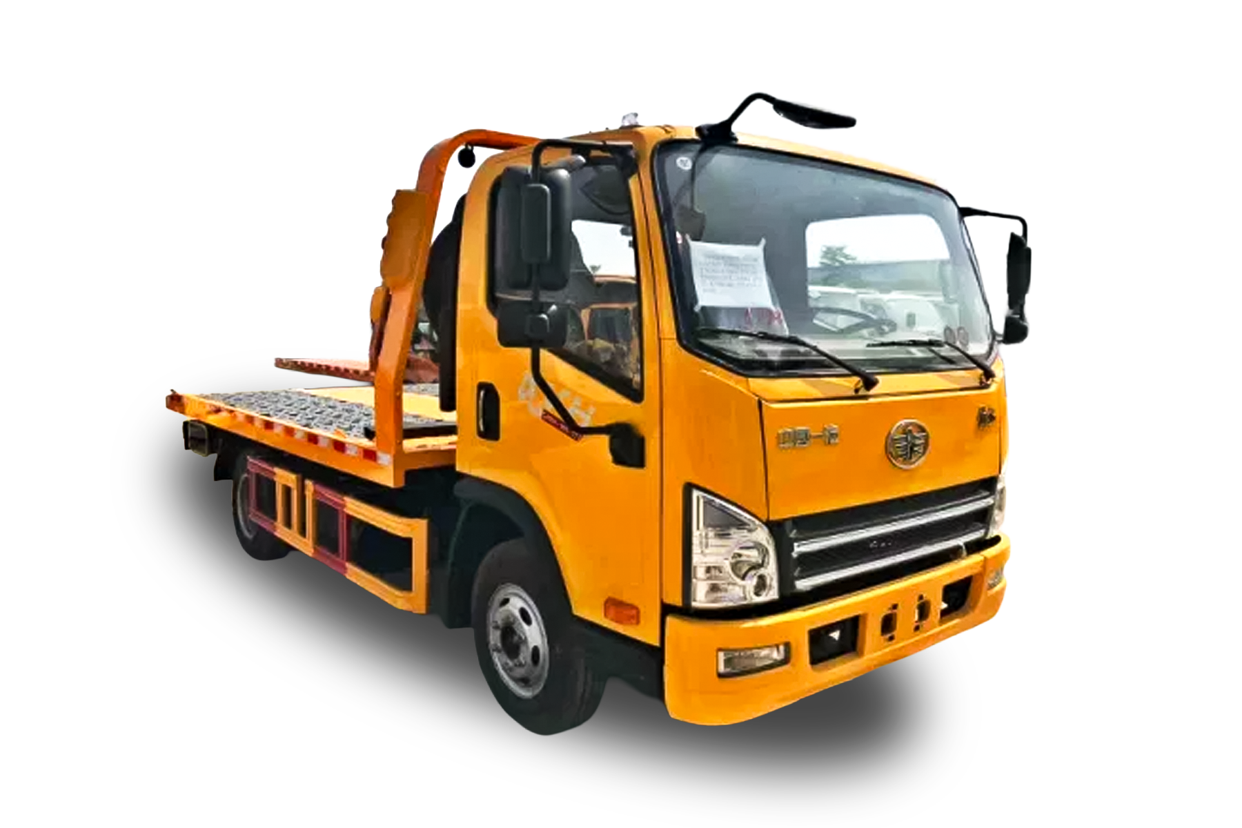 Yellow flatbed tow truck with side mirrors and open cab door window.
