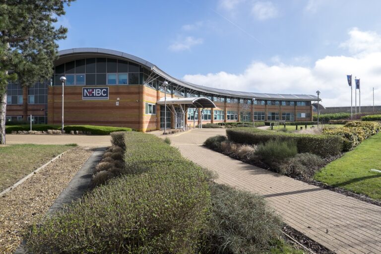 NHBC head office building exterior with landscaped grounds