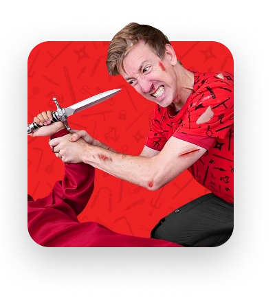 Chad in red Spy Ninjas weapons of Choice shirt fighting with a bad guy
