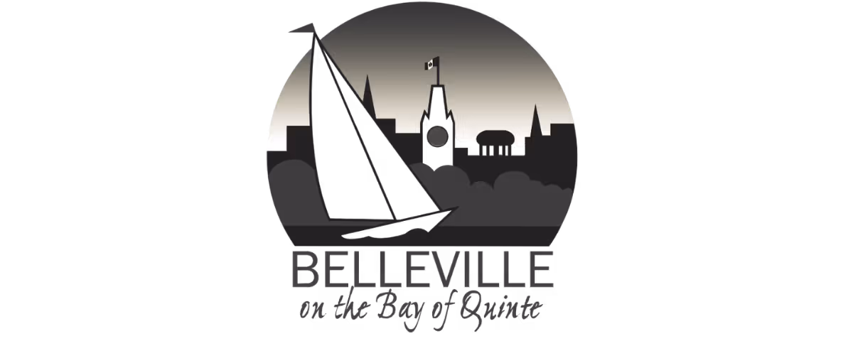 Logo with a sailboat and city skyline with a flag, text reading Belleville on the Bay of Quinte.