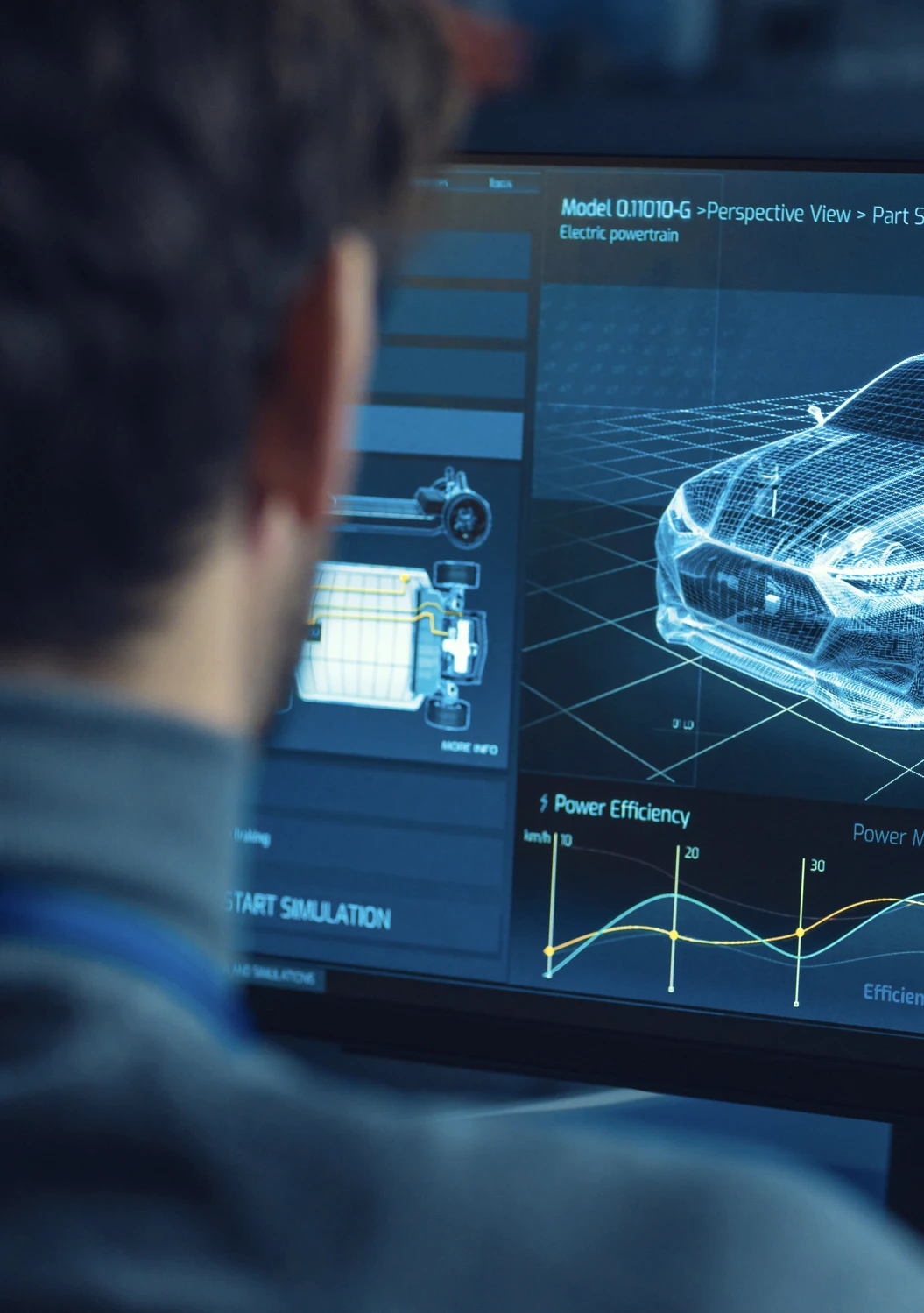 Un ingénieur regarde un écran affichant un modèle 3D et des graphiques d'efficacité d'une voiture électrique.
