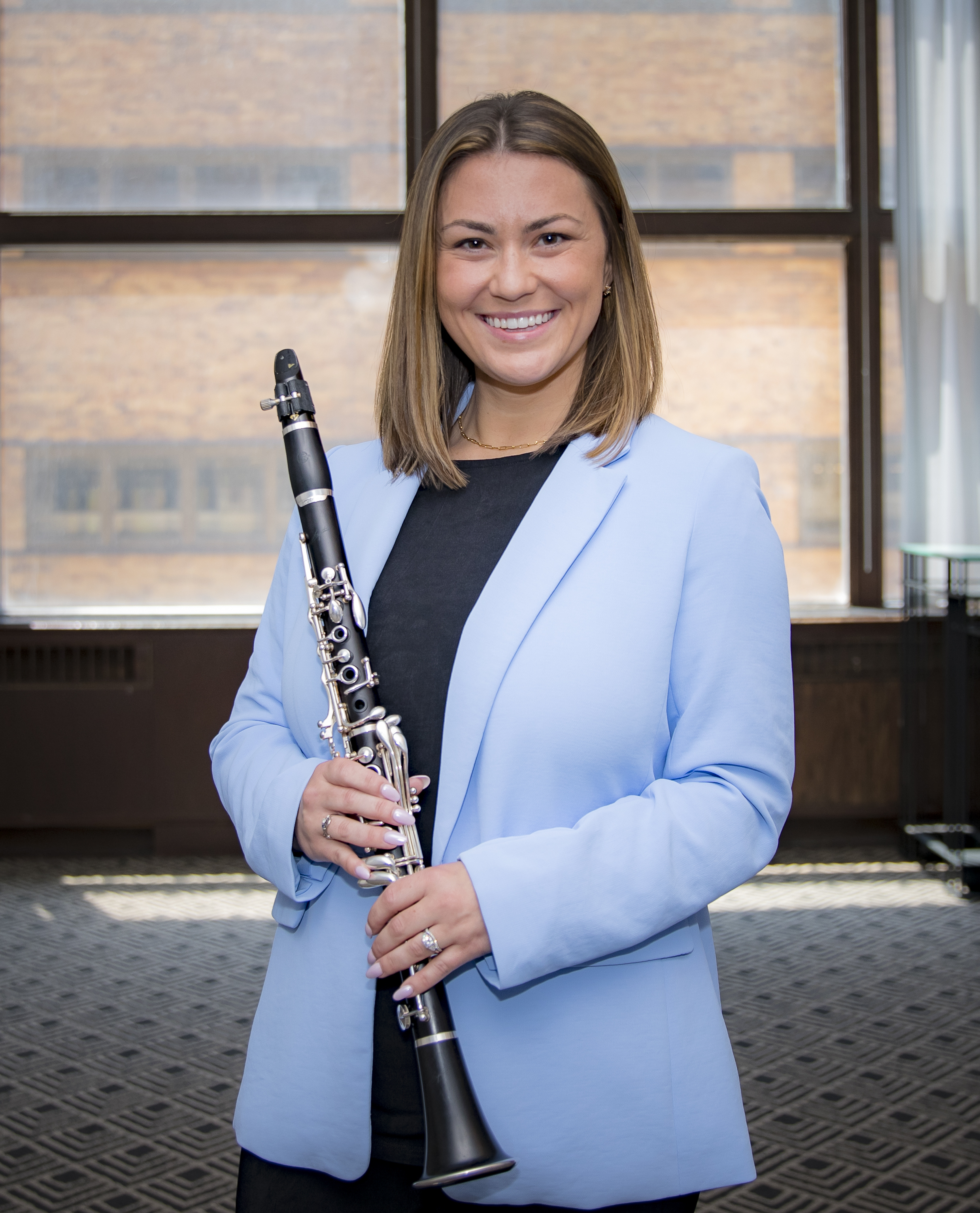 Kelly Riordan, music education entrepreneur and speaker, in a professional portrait for Outside The Bachs.