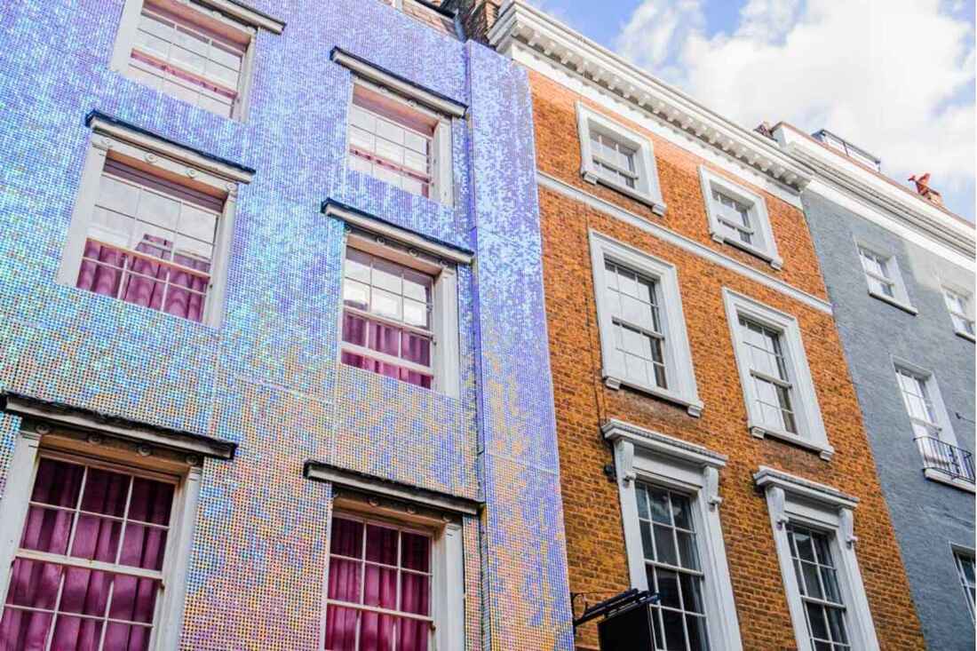 Iridescent sequin wall facade on brick building