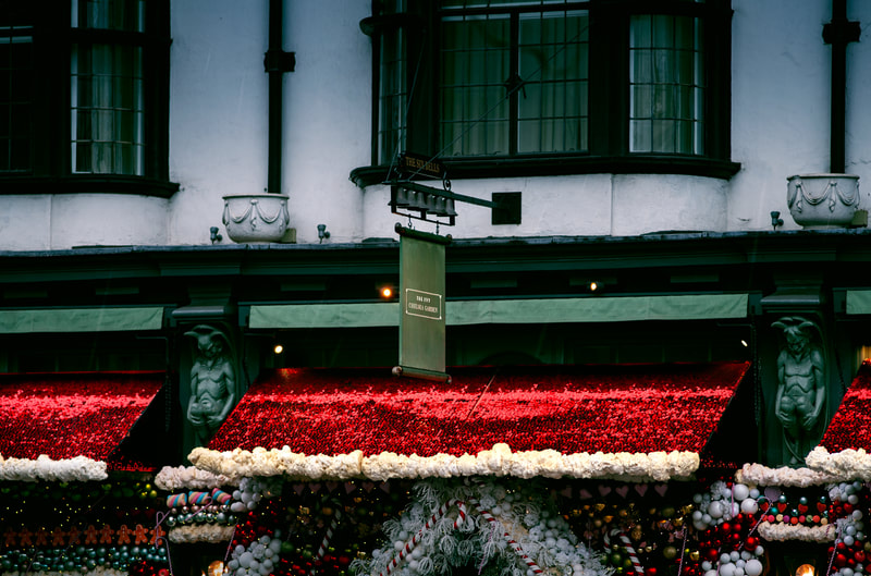 A wide-view of a red sequin backdrop in London.