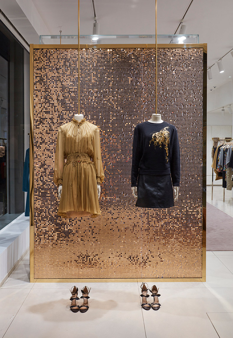 A sequin backdrop display made with gold sequins for a clothing company in London.