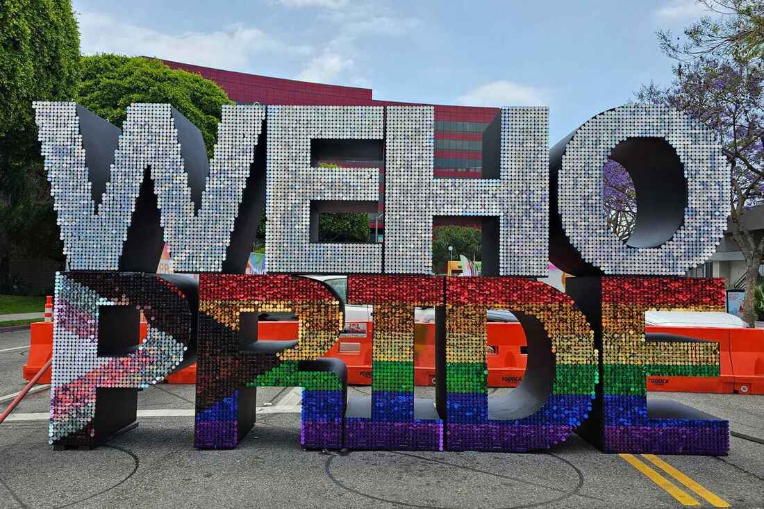 silver sequin letters spelling WEHO, rainbow sequin letters spelling PRIDE