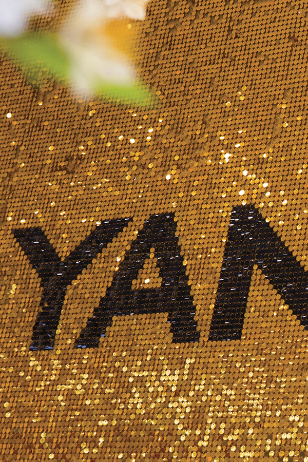yellow gold sequin wall for retail event.
