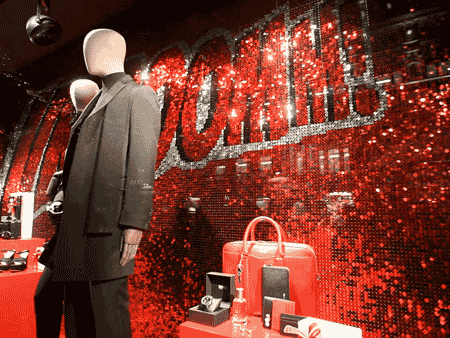 moving red sequin wall with text gif