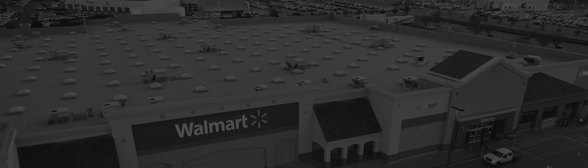 Aerial view of commercial roof with roofing elements and HVAC units installed