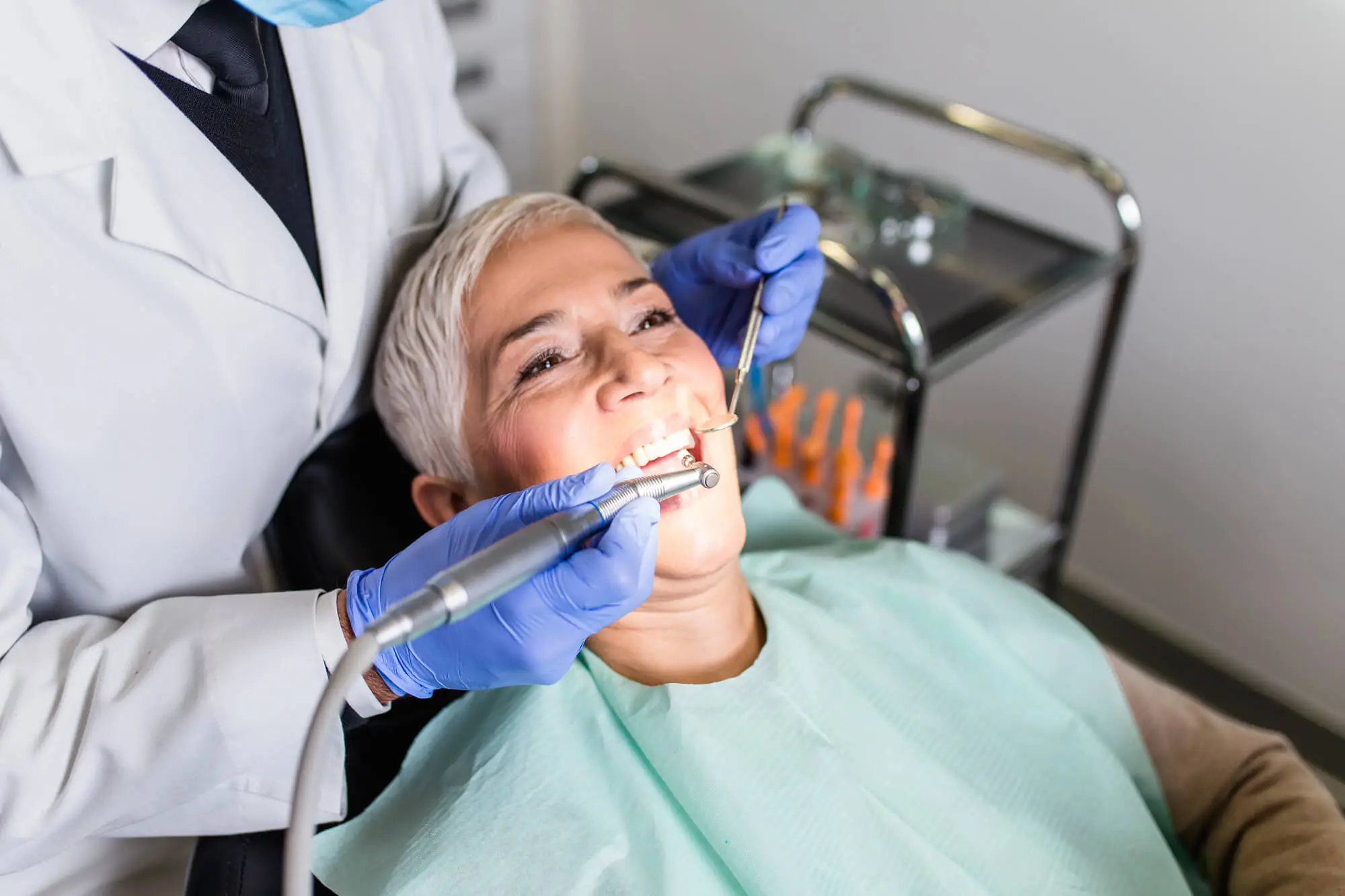 woman getting dentures in Huntersville, NC