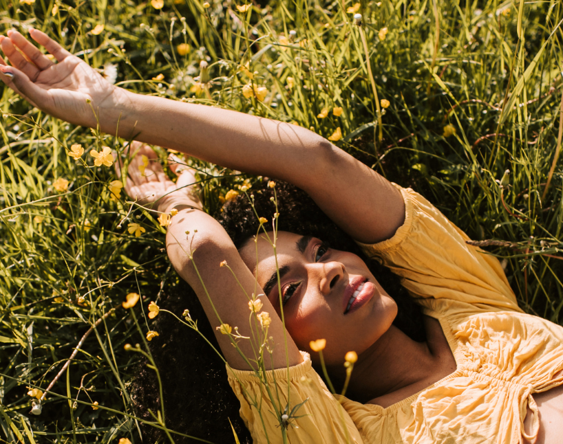 woman laying on ground stock image