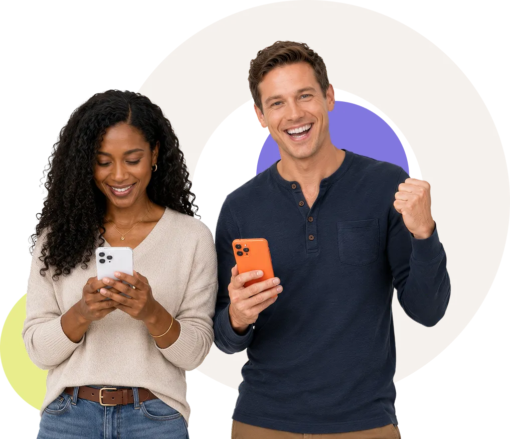 Smiling man and woman holding smartphones; man shows excitement while woman looks at phone screen.