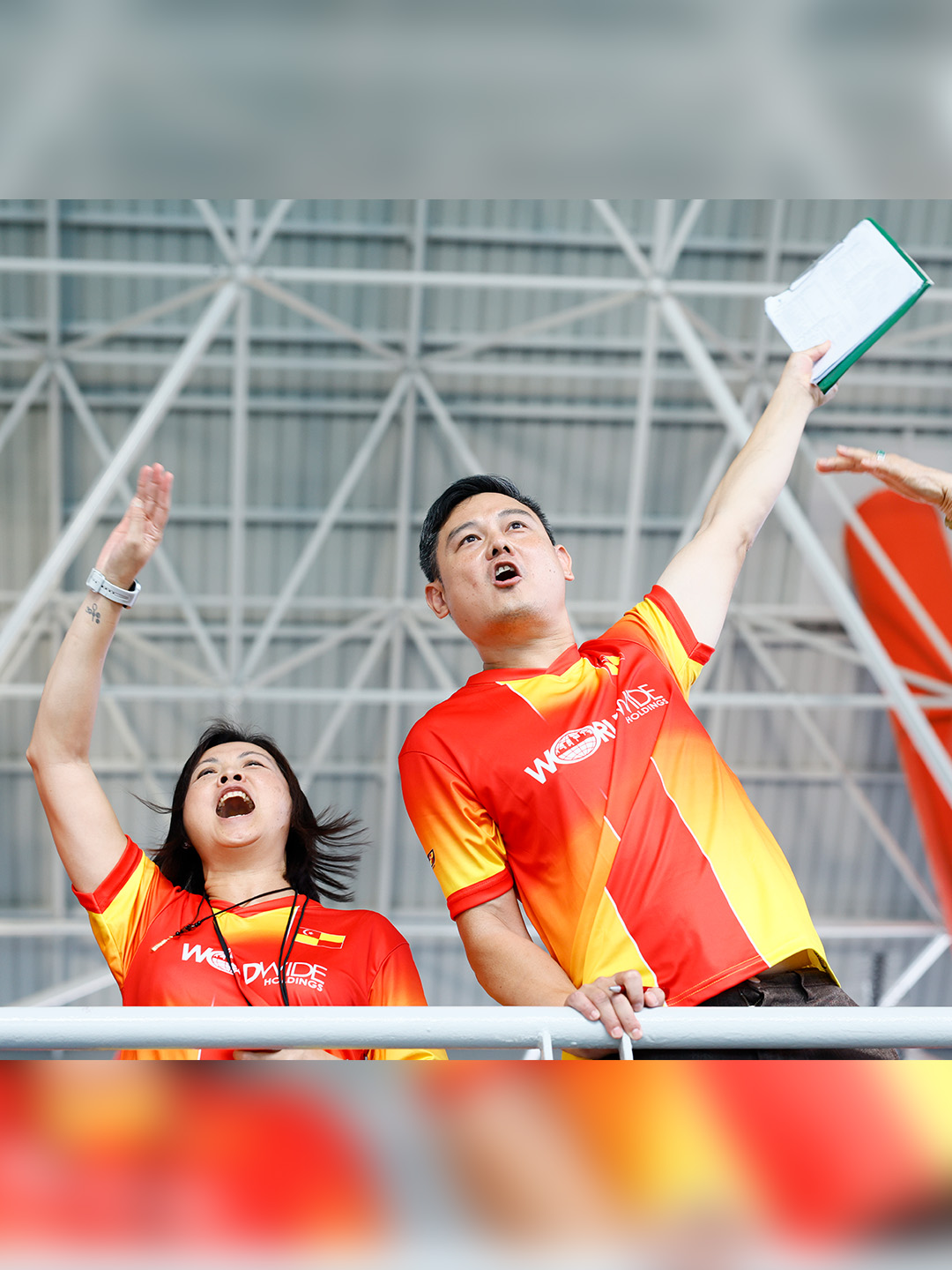 Hermann Bok Yu Tang's family and coaches cheering from the stands