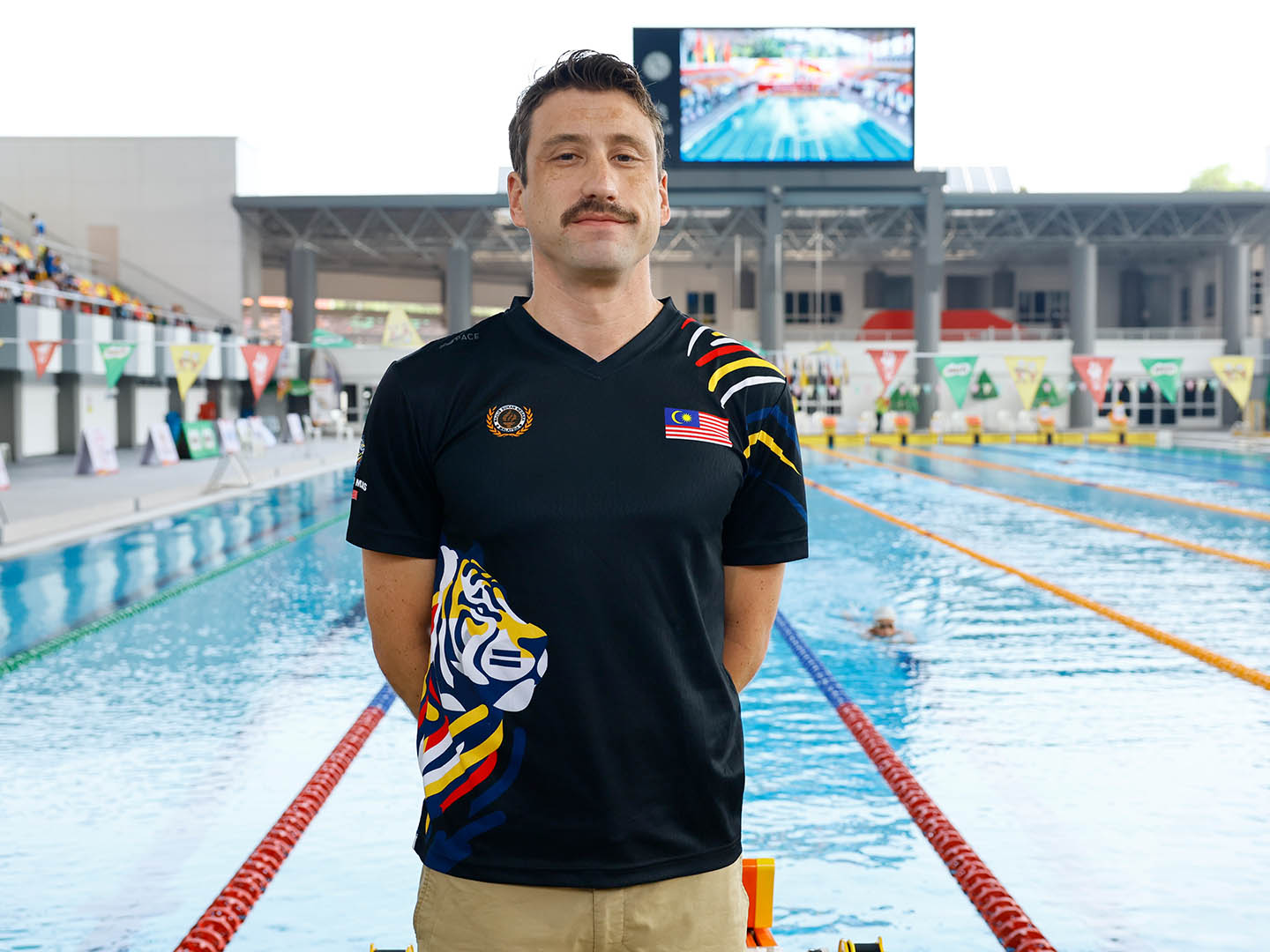 Coach Michael Kinross poolside at the National Training Centre