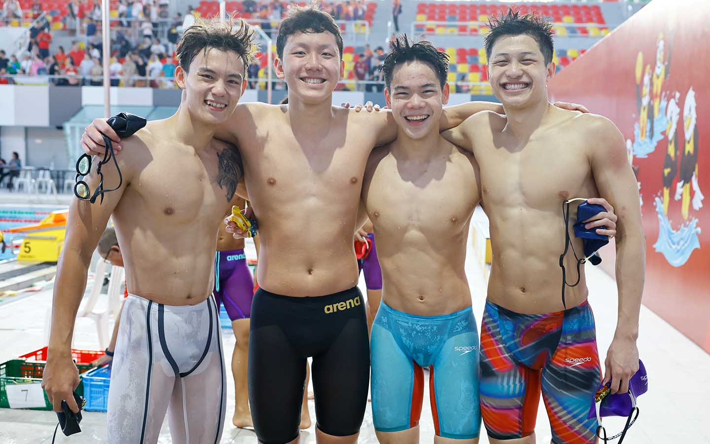 Tong Yu Jing, Samuel Lai, Loo Cheng Feng, and Elson Lee together poolside after the race