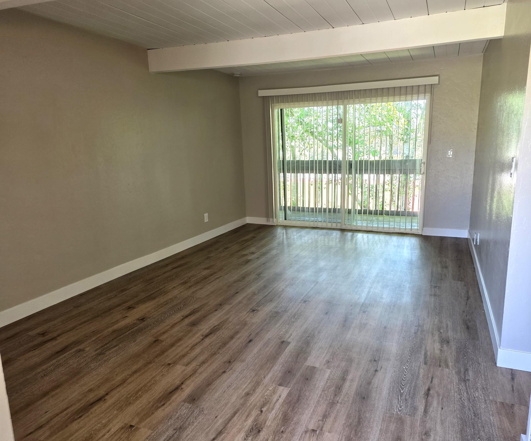 unfurnished living room with large window