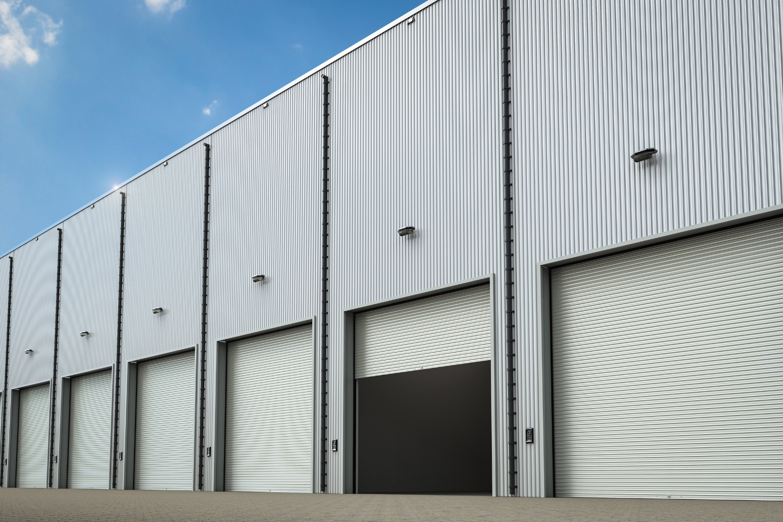 Industrial warehouse exterior with loading bays — building a CIL portfolio