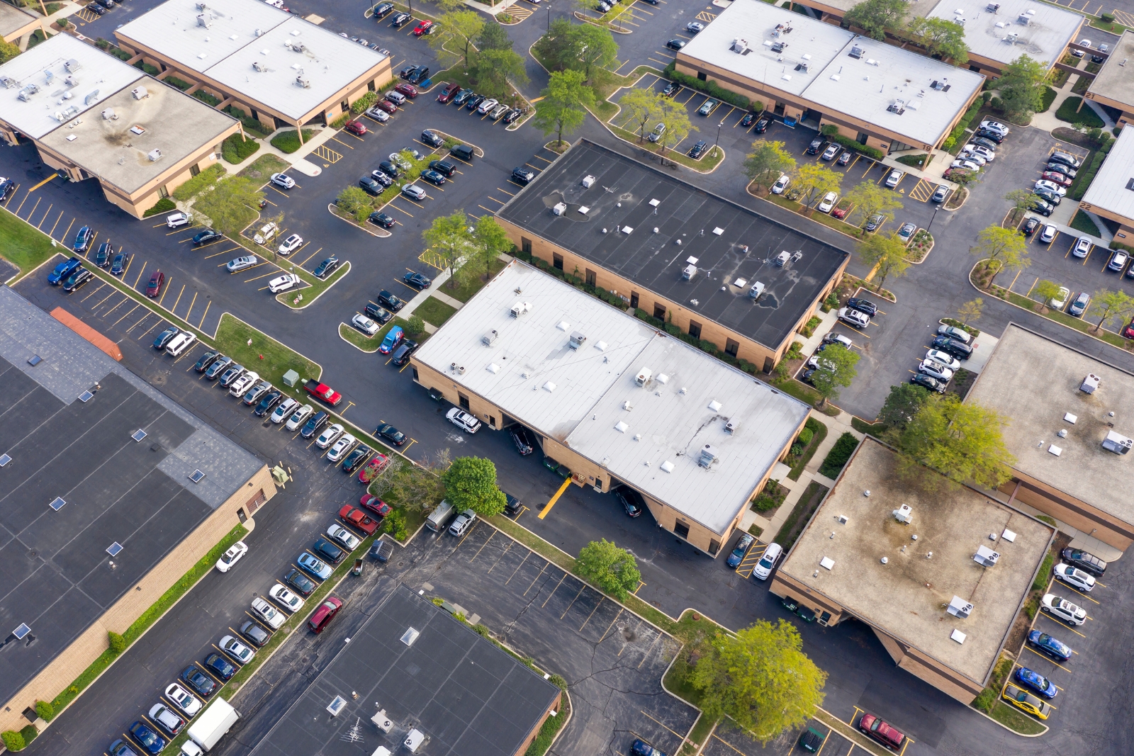 Aerial view of commercial business park — scaling from one property to a portfolio