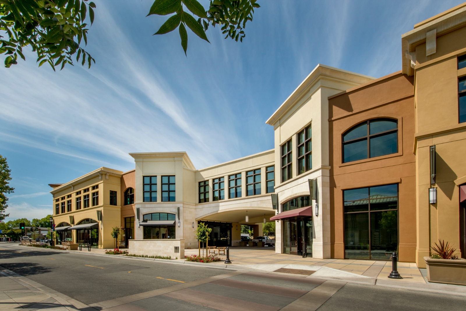 Mixed-use commercial buildings under warm sky — income, appreciation, and asset growth