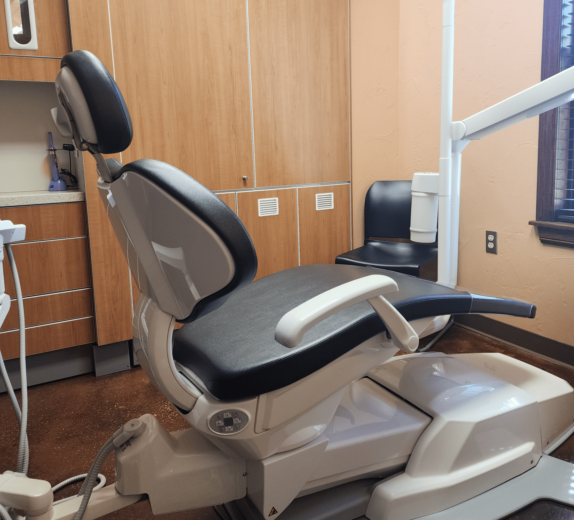 A dental chair in a dental operatory