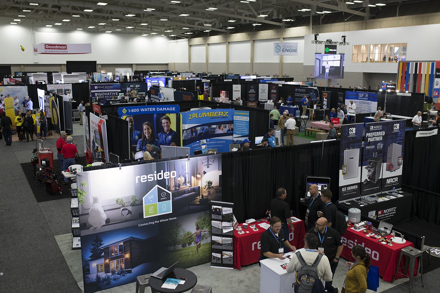 Exhibitor booths on the Service World Expo show floor.