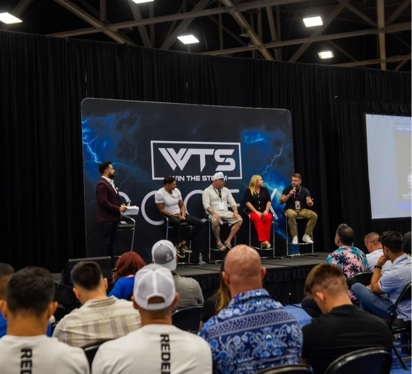 The Win The Storm main stage with the WTS screen lit.