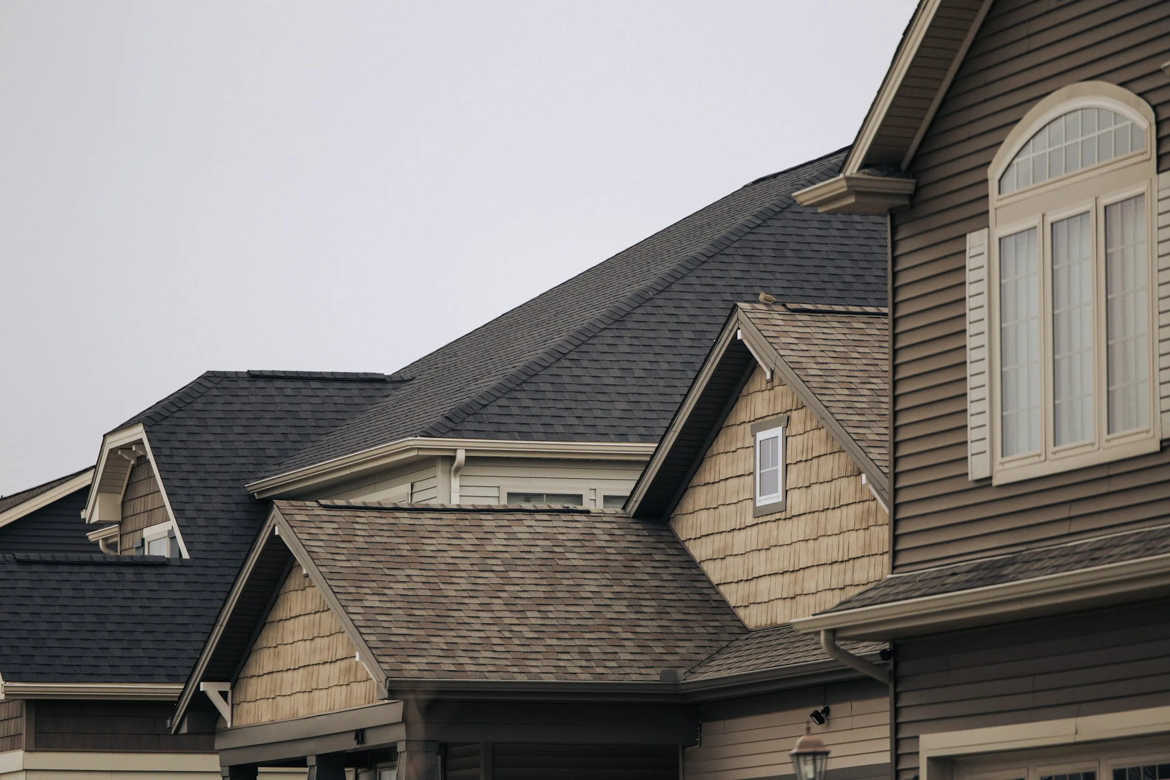 A new architectural shingle roof on a family home, the kind of job Equity Roofing sells
