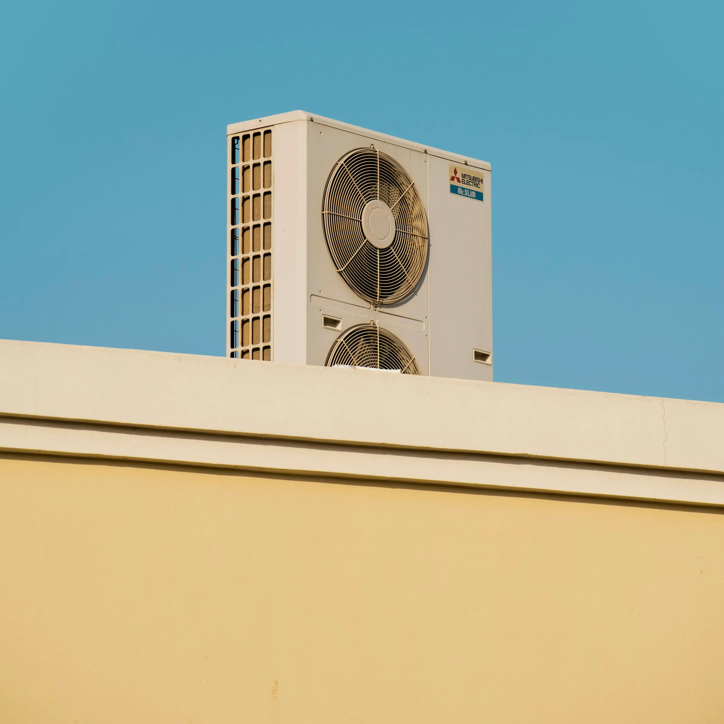 A heat pump on a sunny rooftop, the kind of install Coolforce techs quote