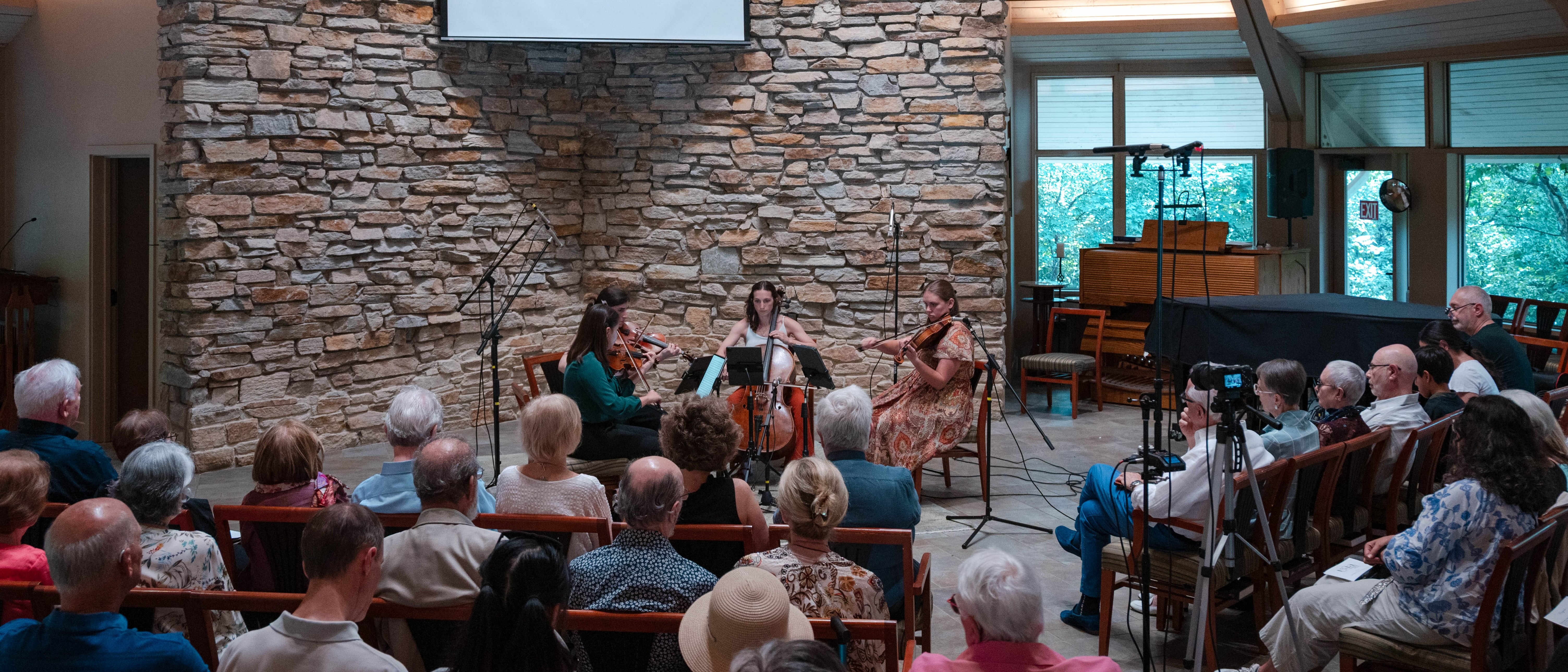 Ixia Chamber Music ensemble performing a live concert in front of an audience
