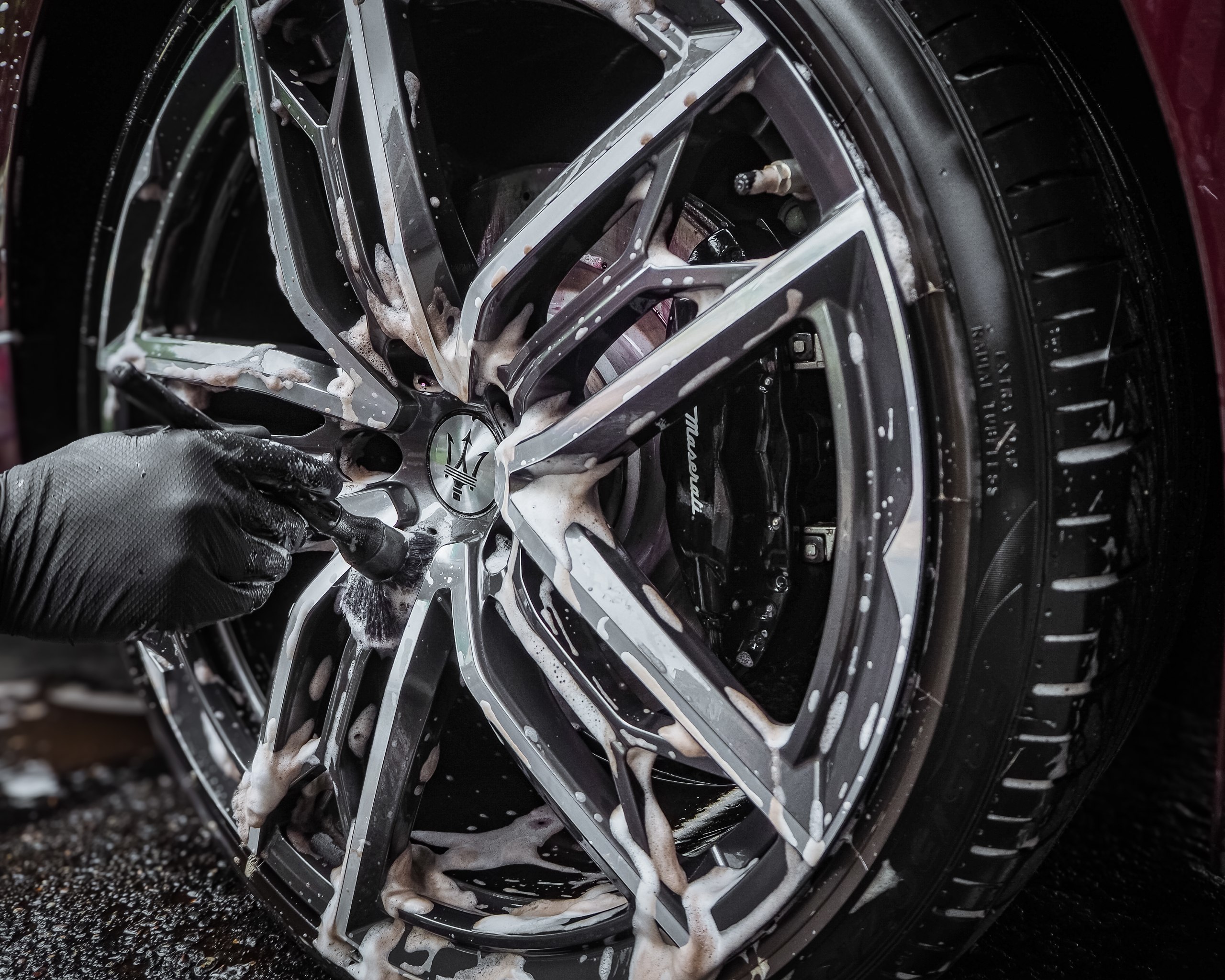 Maserati alloy wheel deep-cleaned to factory finish — pH-balanced brake dust and road salt removal as part of a full exterior detail by High Shine Detailing of Shakopee MN, serving Prior Lake and Savage