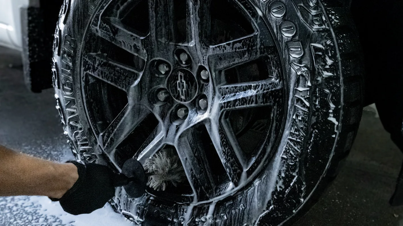 Alloy wheel deep-cleaned with foam and pH-balanced products — brake dust and road salt removal as part of a full exterior detail by High Shine Detailing of Shakopee MN, serving Prior Lake and Savage