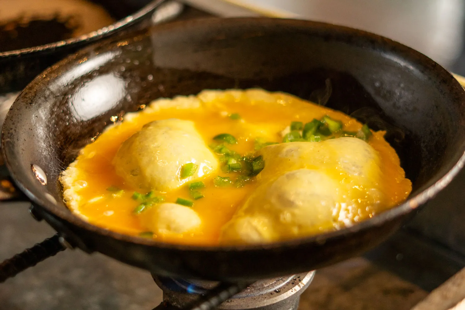 a skillet filled with food on top of a stove