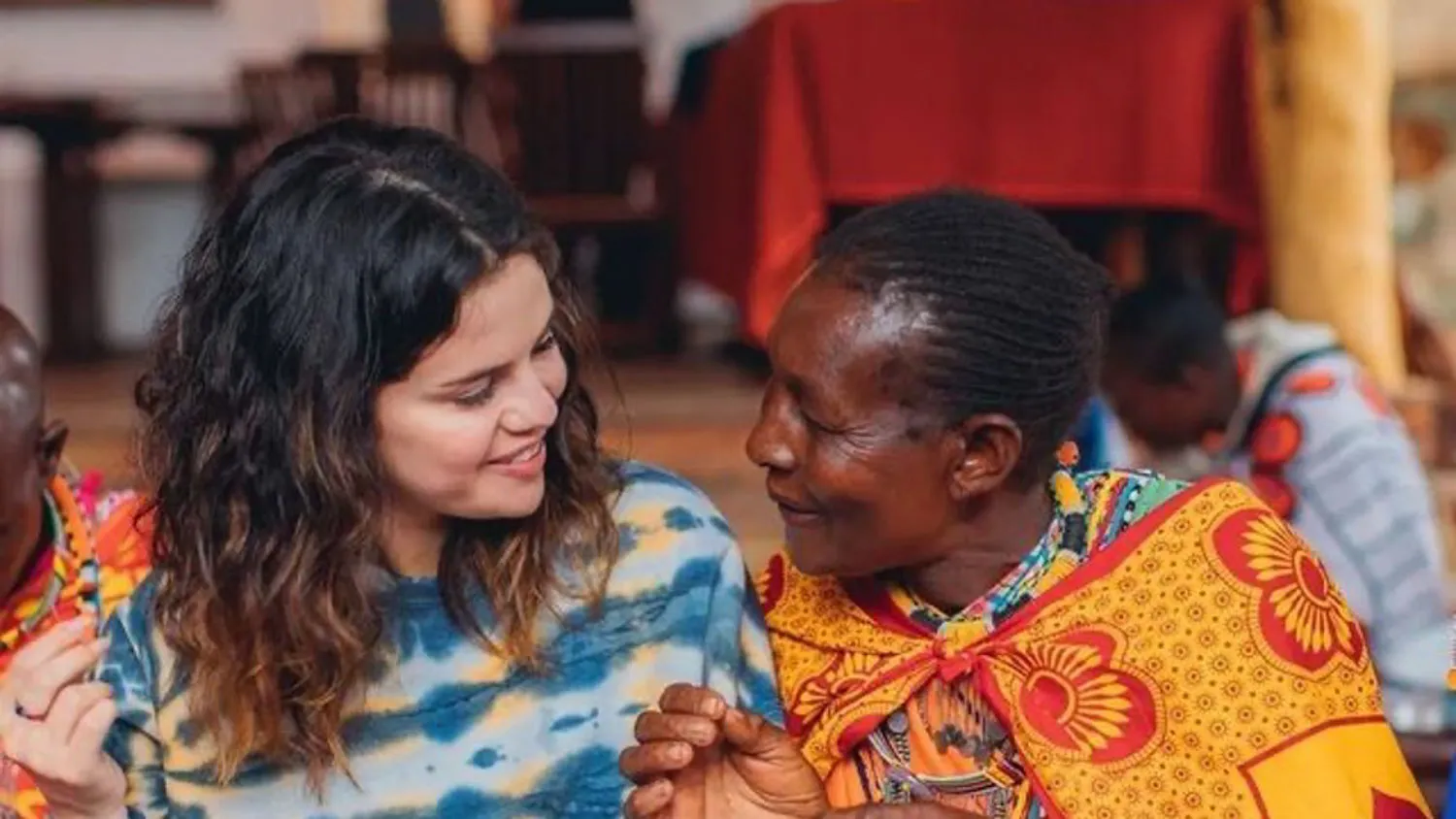 a couple of women standing next to each other