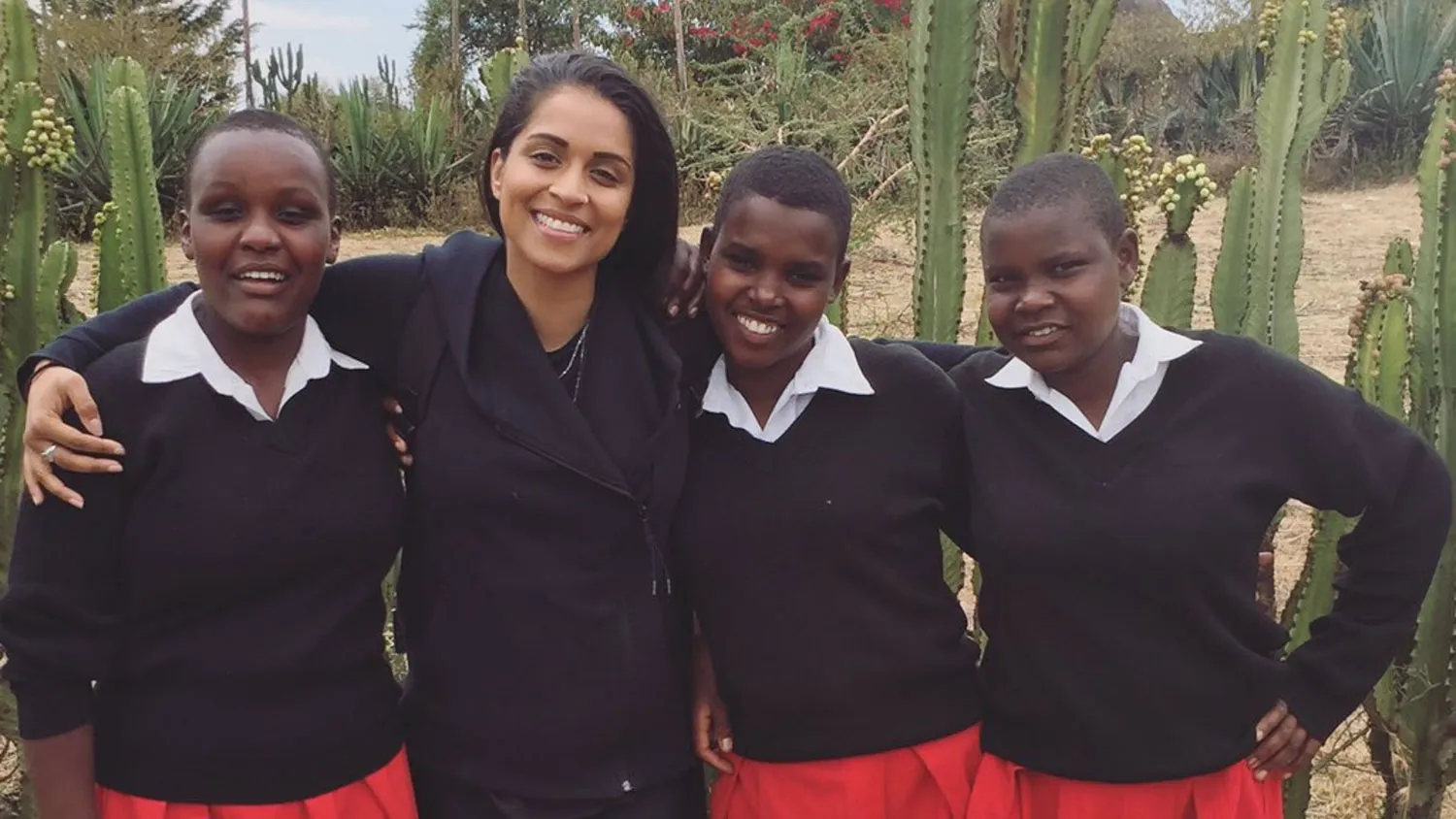 a group of young women standing next to each other